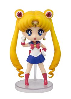 sailor girl figurine with blonde hair and blue eyes, standing on a white surface