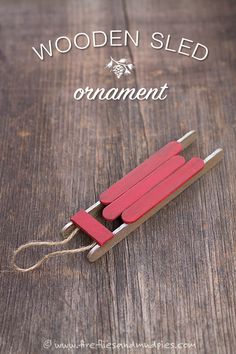 a wooden sled that is sitting on top of a table