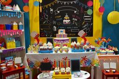 a birthday party with colorful decorations and desserts