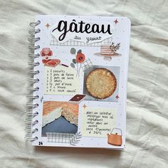 an open notebook with images of cakes and pies