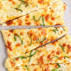 several slices of pizza with cheese and herbs