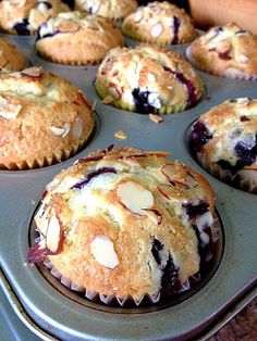 muffins with blueberries and almonds in a pan