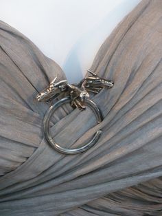 a dress with silver rings attached to it