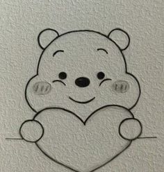 a drawing of a teddy bear holding a heart with the letter n in front of it