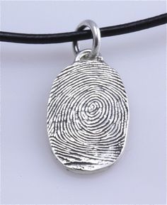 an image of a necklace with a fingerprint on it