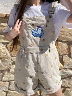 Look no further than with the Stardew Chicken Overalls Shorts! This cute and beautiful overalls is the perfect outfit for the stylish gamer girl. Crafted with care, you'll feel comfortable and look stylish! non-functional pocket Recommendation: The pants are a little short and it is recommended to take one size bigger than usual Material 100% polyester The design is made by embroidery in our workshop. This is an original design by us, Petimint See Shipping policy and Refunds. Jumper Shorts Outfit, Stardew Chicken, Chicken Stardew Valley, Katie Gardner, Overalls Outfit Short, Overalls Aesthetic, Christian Modest Outfits, Cute Colorful Outfits, Overall Shorts Outfit