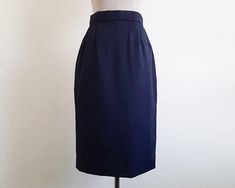 Vintage Navy Blue Skirt - Label : LANVIN  - Fabric : 100% wool - Nylon zipper on the back - Lined - Made in France Good vintage condition but the skirt has a small hole. Please see the two last photos. Measurements : Waist : 25.5" Hips : 37" Total length : 27" Our products are vintage clothing that will be cleaned so you can be confident in the quality. We carefully inspect each garment to make sure that you get the most accurate and informed description possible. We do our best to state any imp Vintage Fitted Mini Pleated Skirt, Fitted Vintage Mini Pleated Skirt, Blue Fitted Midi Skirt, Elegant Blue Fitted Skirt, Elegant Fitted Blue Skirt, Fitted Vintage Blue Skirt, Blue Fitted Long Skirt, Fitted Long Blue Skirt, Formal Fitted Full Mini Skirt