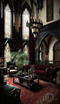 a living room with red couches and chandelier hanging from the ceiling in front of windows