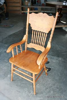 a wooden rocking chair sitting in a room