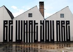 an image of a building that is painted black and white