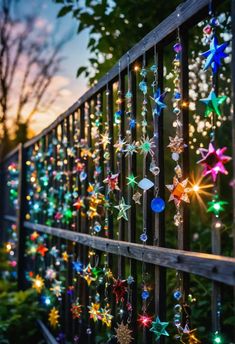 colorful lights are hanging on the fence