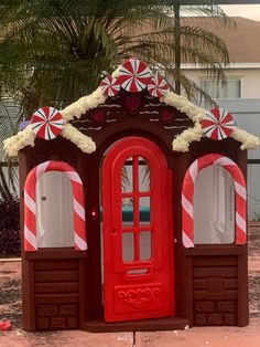 a red and white candy cane covered building