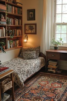 a bedroom with a bed, desk and bookshelf full of books in it