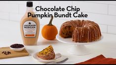 chocolate chip pumpkin bundt cake on a plate with a bottle of jack - o'- lantern syrup