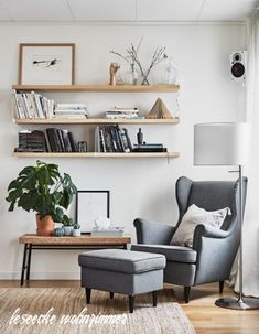 a living room filled with furniture and books