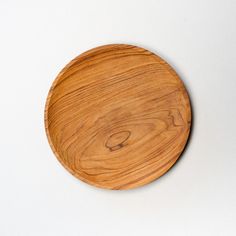 Looking for a set of high quality wooden plates? Indulge in your favorite meals in a sustainable way with our Wooden Plates. Each wooden plate is uniquely handcrafted by artisans using traditional techniques and sustainable teak wood, making it not only a beautiful addition to your table but also an eco-friendly choice. Perfect for any occasion, from casual dinners to special events, these wooden plates have a classic design that complements any style of food. The natural wood grain of the teak Bamboo Cups, Coconut Candle, Wooden Products, Coconut Bowl, Wooden Plate, Eco Friendly Home, Favorite Meals, Ocean Conservation, Wooden Plates