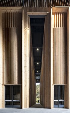 the entrance to an empty building with wooden slats on it's walls and doors