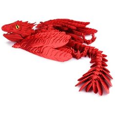 a red dragon made out of paper on a white background