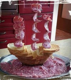 a plate that has some kind of food on it with meat in the shape of a boat