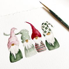 three gnomes painted in watercolor on white paper with green and red polka dots