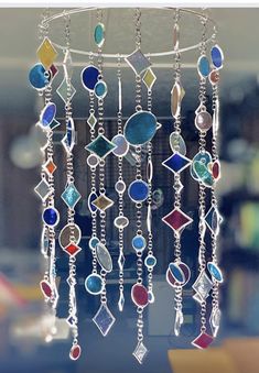 a wind chime with many different colored beads hanging from it