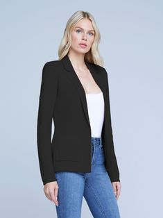 An effortlessly chic knit blazer in black. Classic tailored details like lapels and patch pockets complement soft, luxurious knit done in a lightly textured stitch. Clean silhouette tapers at waist for a flatteringly sleek fit. Tonal embossed-dome button closure. Elegant Single Breasted Cardigan For Business Casual, Elegant Lapel Collar Cardigan For Work, Elegant Cardigan With Lapel Collar For Workwear, Elegant Lapel Collar Cardigan For Office, Sleek Structured Blazer For Business Casual, Elegant Tailored Cardigan With Lapel Collar, Fitted Notch Lapel Versatile Blazer, Tailored Versatile Blazer For Work, Tailored Versatile Blazer For Business Casual