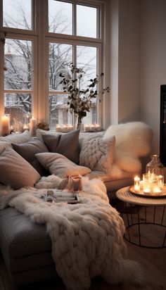 a living room filled with lots of furniture next to a large window covered in candles