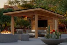 an outdoor living area with fire pit and seating