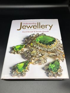 "I'm not going to lie, I have two of these books, I am keeping one for my own collection and references. Such wonderful information and stunning pictures. This book, \" Understanding Jewellery\" written by David Bennett and Daniela Mascetti is an antique collectors club book. This is a pre owned book The dust cover is in nice used condition No writing on pages, no rips, no tears, no stains Published 2006, this is the 6th edition Pages 494 Measures 11 1/4\" x 9 3/4\" x 2\" tall" David Bennett, Antique Collectors, Reference Book, Vintage Cake, Dust Cover, Designer Jewelry, The Collector, Music Book, Jewelry Design