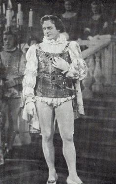 an old black and white photo of a man in costume