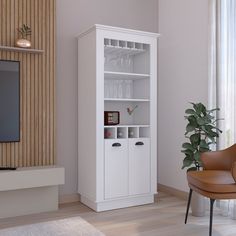 a living room with a white bookcase next to a chair