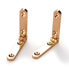 pair of gold plated metal door handles on white background, with clippings