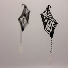 Cobwebs is an original design, crafted to sit over your ear. Each pair comes with 'NerdiDesigns' instructions for wear, and the dangling spider (spider is optional--you can easily remove it if you prefer a more minimalist look!) Perfect for adding a touch of gothic flair to your style. or just freaking out your local arachnophobe Please note: These earrings have been tested for strength and durability. To ensure longevity, handle each set with care and store them away from direct sunlight and UV Spiderweb Design, Jewelry Halloween, Halloween Accessories, Gothic Jewelry, Look Plus, Spider Web, Accessories Unique, Jewelry Earrings Studs, Original Design