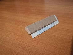 a piece of paper sitting on top of a wooden table