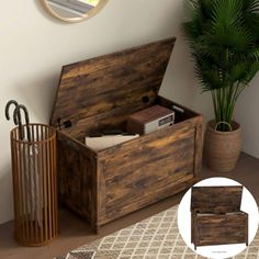 an open wooden box sitting on top of a table next to a potted plant