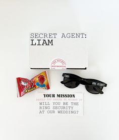 the secret agent sign is next to some sunglasses and a candy bar on a white surface