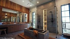 a large bathroom with wooden walls and flooring