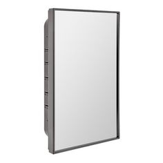 a large mirror mounted to the side of a wall next to a light switch box