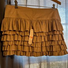 Gianni Bini Nwt Ruffled Mini Skirt (Juniors) Brown Tiered Ruffle Skirt, Fitted Brown Bottoms With Ruffles, Brown Ruffled Tiered Mini Skirt, Spring Brown Skirt With Ruffles, Spring Brown Ruffled Skirt, Fall Ruffled Tiered Skort, Brown Ruffled Mini Skirt, Brown Ruffled Skirt, Tan Mini Skirt