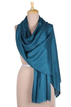 Wrap yourself in the warmth of wool and the luxury of silk wearing this richly colored shawl designed by India's Saqib Khan. The artisan weaves the shawl on a loom with a luxurious blend of wool and silk in a pretty teal color while a short row of fringe on either end adds subtle detail. Shawl, Teal Shawl, Teal Color, Dark Teal, Teal Colors, Loom, Silk, Wool, How To Wear