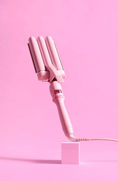 What it is: Create mini waves in seconds with this mini waving tool in a pure pink hue.What it does: This must-have hair tool creates beachy, 90s, boho or glam waves in seconds. It's the game-changer for hair any length or texture. This medium sized waver is the little sister of the 1.25" waver, it creates a smaller more defined wave for that on-trend ripple effect. How to use: Hair should be clean, dry and free of tangles before using. Rest the iron on its stand on a smooth, heat-resistant flat surface, and plug it in. Press and hold the ON/OFF button until the unit turns on and the ON indicator lights up. Adjust the temperature using the left and right buttons to reach your desired heat. For healthier styling we suggest using 180°C/360°F heat setting unless you have very course/thick hai Glam Waves, 90s Boho, Healthy Style, Hair Tool, On Off Button, Ripple Effect, Free Fabric, Flat Surface, Game Changer