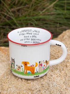 a coffee cup with an animal design on it sitting on top of a stone wall