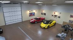 two sports cars parked in a garage next to each other