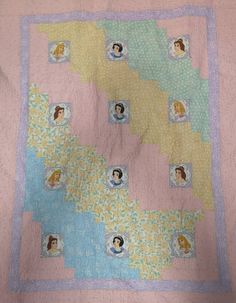 a quilt with pictures of people on it