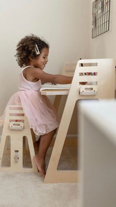 A little girl sits at a wooden children's desk and stool set and writes in a book. Girls Room Desk, Girls Desk Area, Kids School Desk, Desk For Girls, Room Desk Ideas, Kids Desk Space, At Home Desk, Desk For Girls Room, Girls Desk