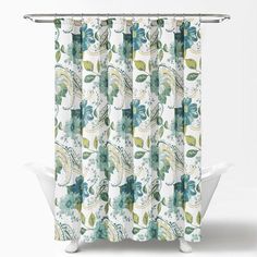 a shower curtain with blue and green leaves on the outside, in front of a white background