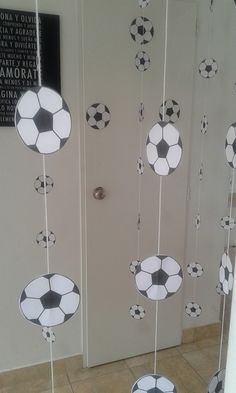 the door is decorated with soccer balls and streamers