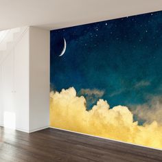 an empty room with a large mural on the wall and clouds in the foreground