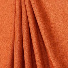 an orange fabric is shown in close up