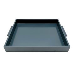 a gray tray with black handles on a white background